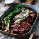 Grilled Bavette Steak with Garlic-Chilli Butter and Charred Spring Onions