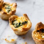 Mini Puff Pastry Quiches with Spinach and Cheddar