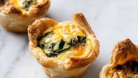 Mini Puff Pastry Quiches with Spinach and Cheddar