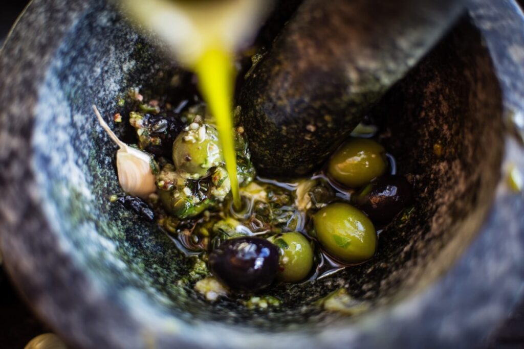 Preparation of Spanish Olive Tapenade with Garlic and Herbs